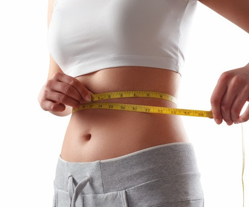 close-up-slim-woman-measuring-her-waist-s-size-with-tape-measure_159057-491-1